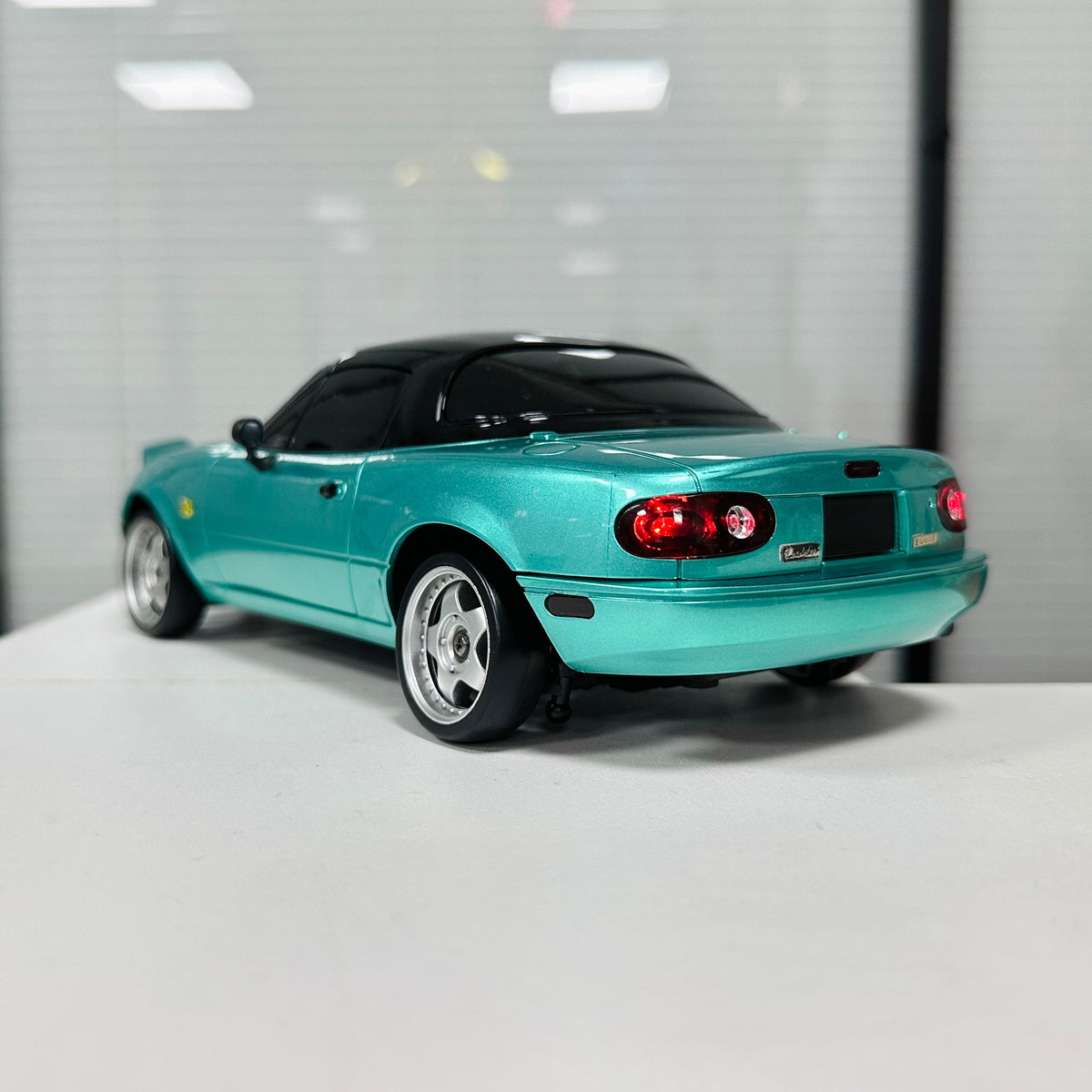 Red and green LDRC LD1804 Mazda RC drift cars