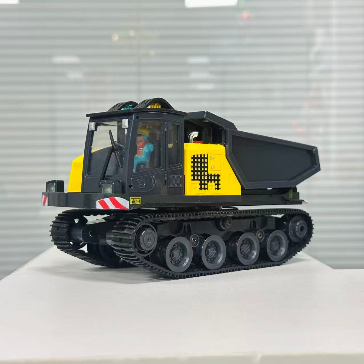 Yi Gong T14R crawler dump truck side view